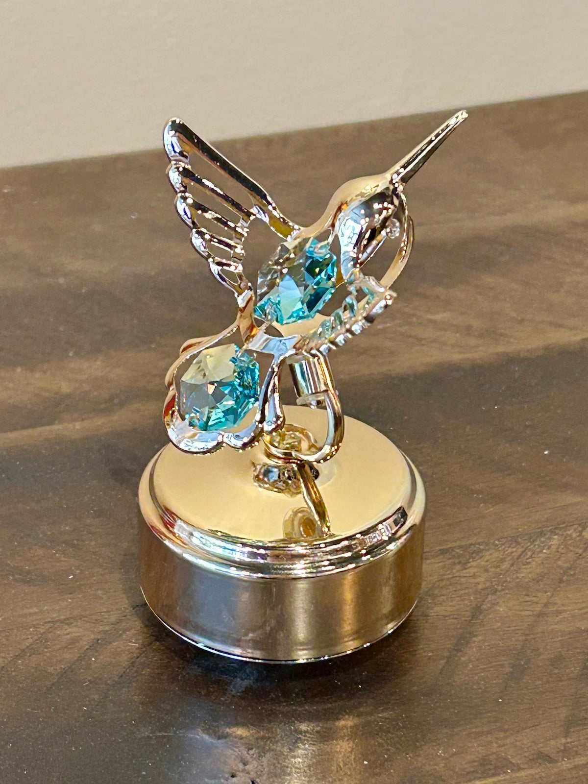 24k Gold Plated Revolving Musical Hummingbird with Green Swarovski Crystals