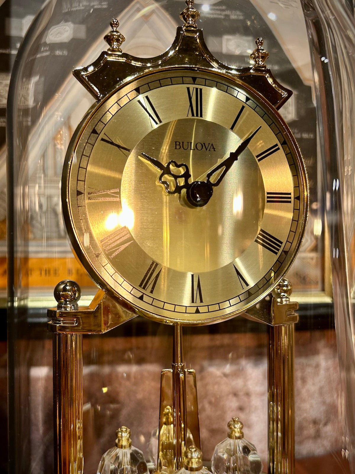Bulova Tristan Dome Rotating Pendulum Gold Clock