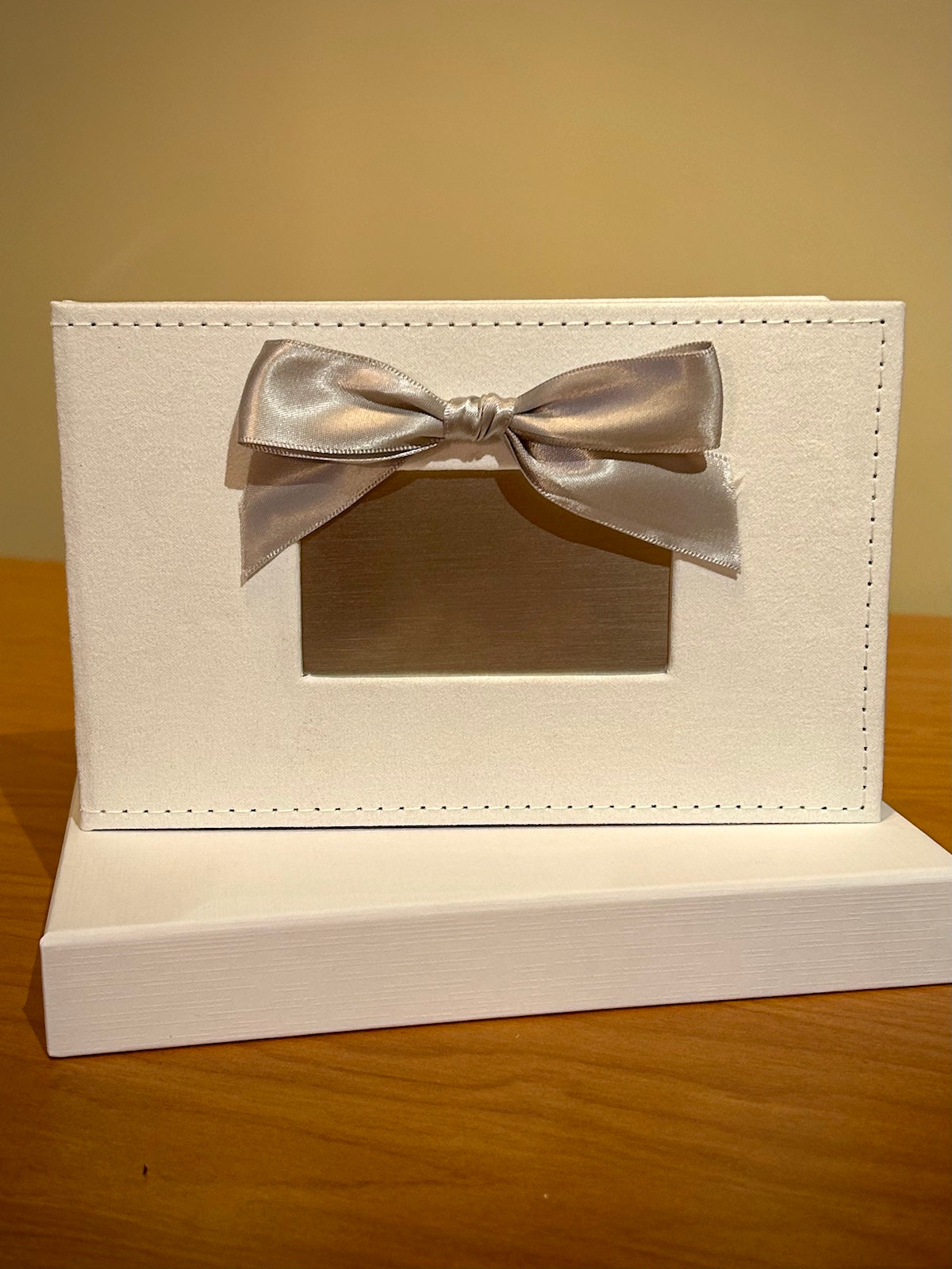 White Photo Album with Silver Bow