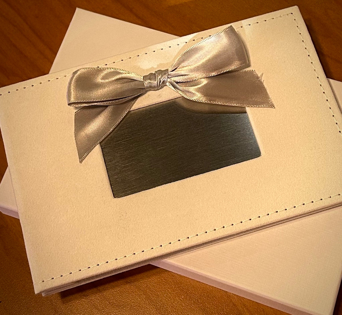 White Photo Album with Silver Bow