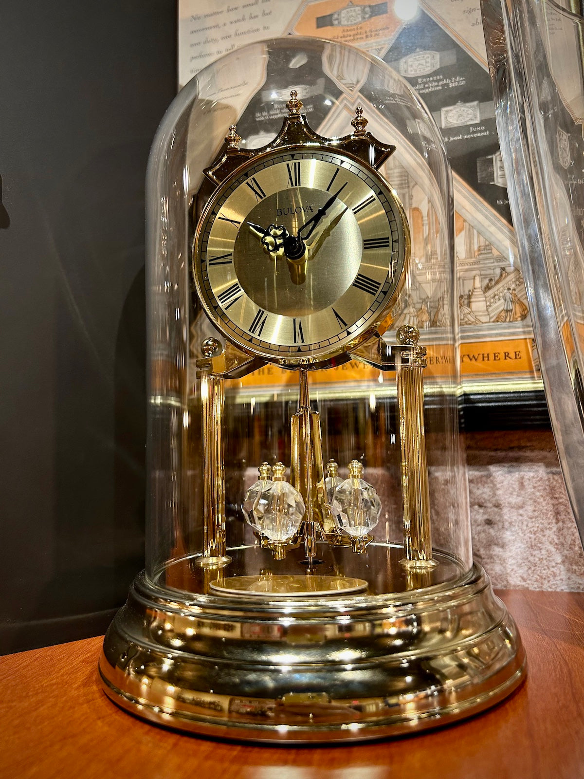 Bulova Tristan Dome Rotating Pendulum Gold Clock