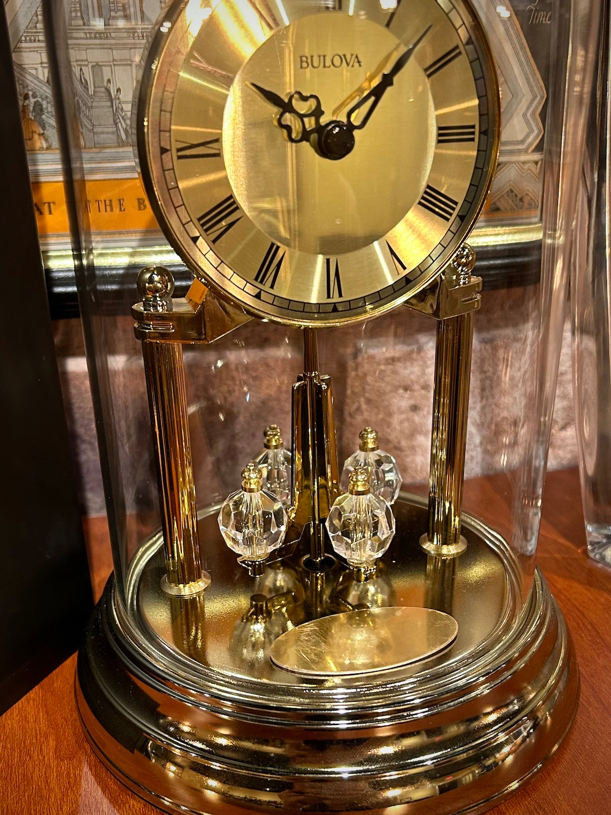 Bulova Tristan Dome Rotating Pendulum Gold Clock